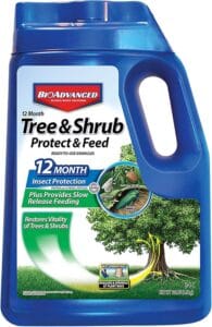 Container of BioAdvanced 12‑Month Tree and Shrub Protect and Feed granules used for systemic insect control and slow‑release fertilizing at the base of trees and shrubs.