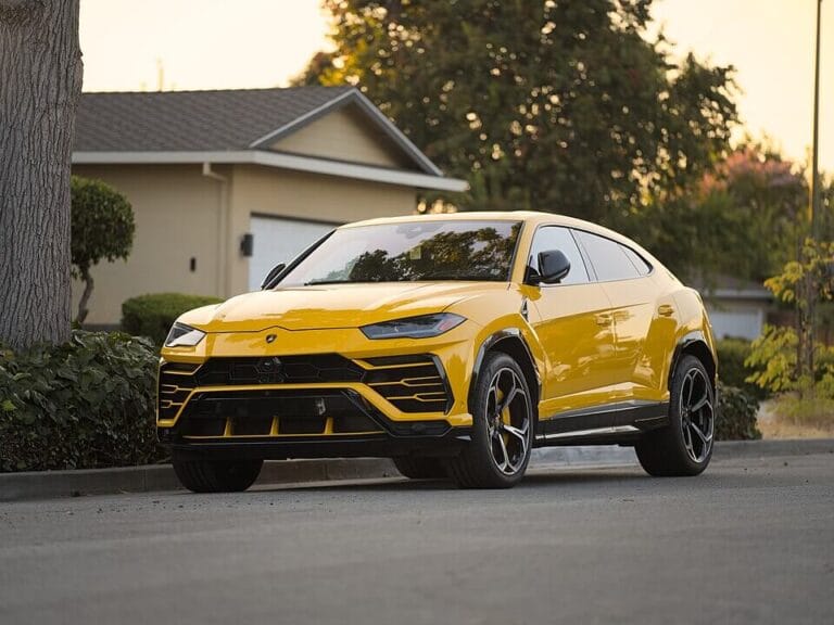 Yellow 2026 Lamborghini Urus parked in a neighborhood, used to illustrate vehicle types where ticks may hide. Automotive Pest Control
