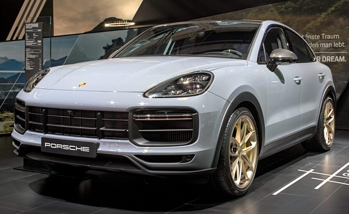 Ticks in your car; 2026 Porsche Cayenne SUV in a showroom, used to illustrate where ticks can hide inside vehicle interiors